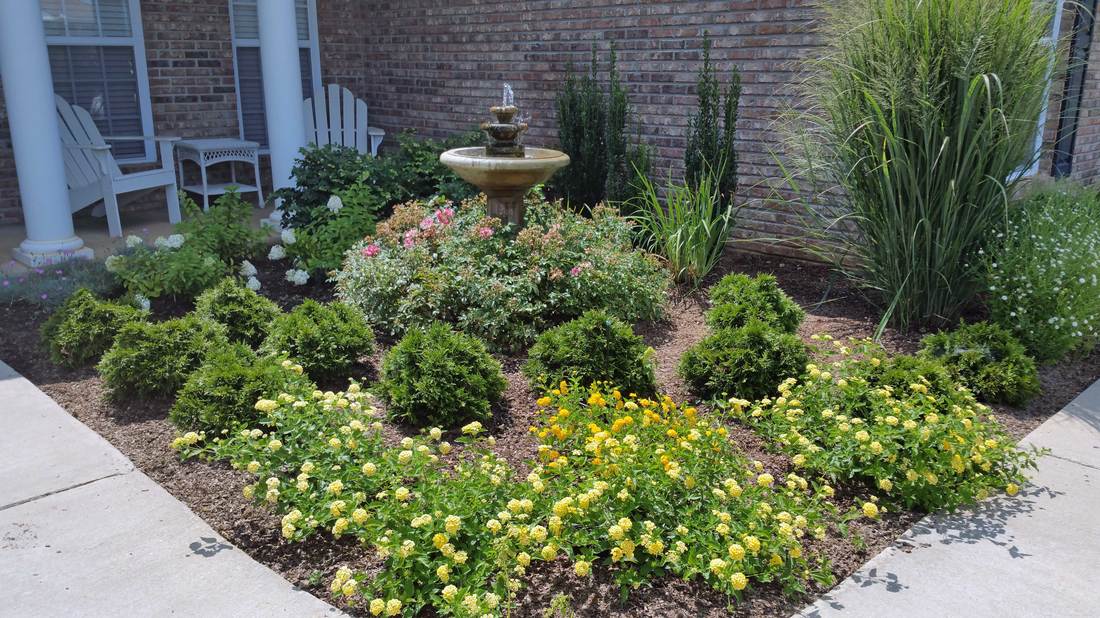 Green Thumb Design landscape bed with perennials and shrubs after installation.